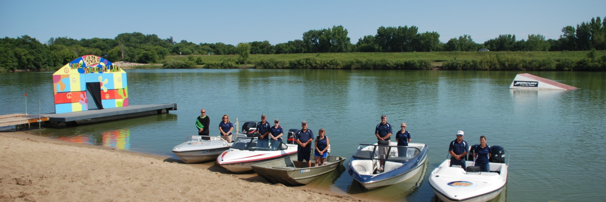 five boats at shore on water