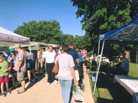 people walking at farmers market