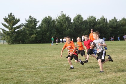kids running in flag football
