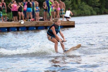 young girl water skiing