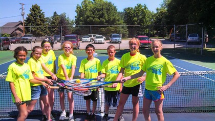 children on tennis court