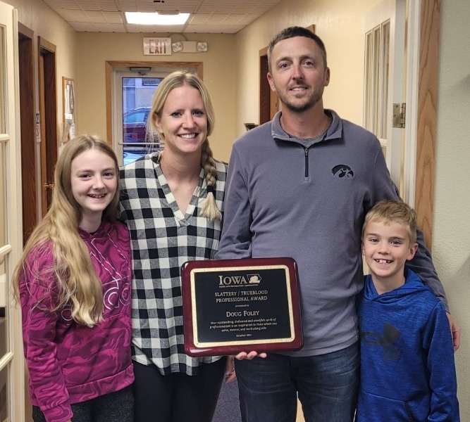 Doug Foley and family with award plaque